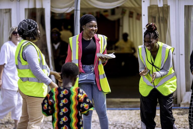 A ZNVA volunteer with children at a community event in Newport